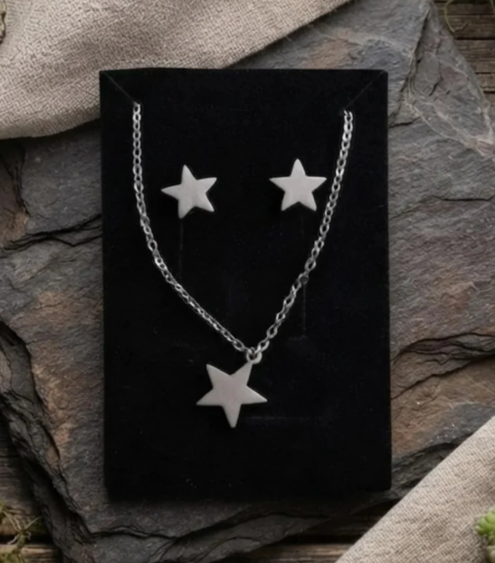 Conjunto en acero colgante y pendientes de estrella